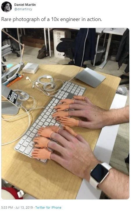 Viral Twitter post showing multiple hands typing on a keyboard captioned 'Rare photograph of a 10x engineer in action'.