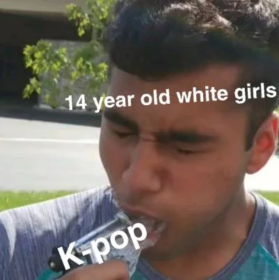 14 Year Old Girls — man holding a gun in his mouth representing 14 year old and korean pop music