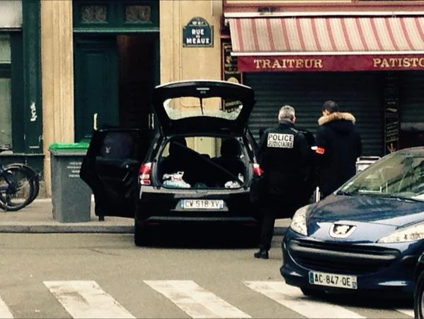 2015 Charlie Hebdo Terrorist Attack — French judicial police inspecting the abandoned getaway car on Rue de Meaux