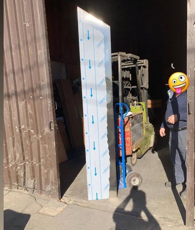 2020 Metal Monoliths — Stylized meme image showing a monolith with blue downward arrows and a laughing emoji-faced figure.