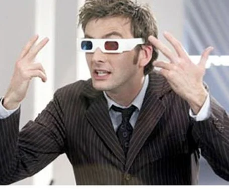 Professional-quality image of man wearing authentic red and blue 3D glasses without text overlay.