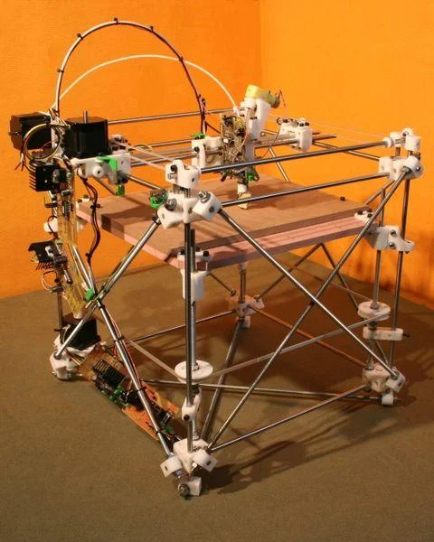 3D Printing — RepRap style open-frame DIY 3D printer with metal rods and white plastic connectors