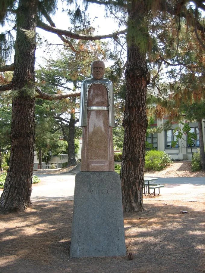420 — Louis Pasteur statue at San Rafael High School surrounded by trees