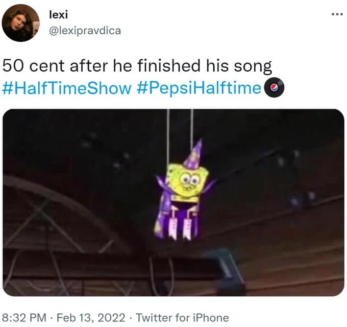 50 Cent Hanging Upside Down — Upside-down person captioned about 50 Cent after finishing song at halftime.