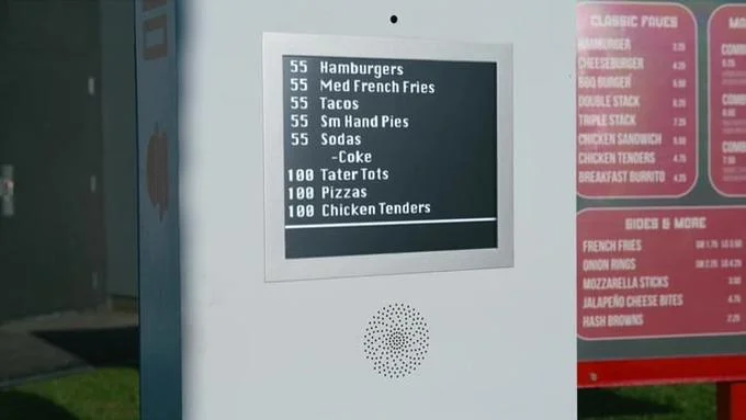 55 Burgers 55 Fries 55 Tacos 55 Pies — Restaurant menu board displaying '55 Hamburgers, 55 Fries, 55 Tacos, 55 Hand Pies' items.