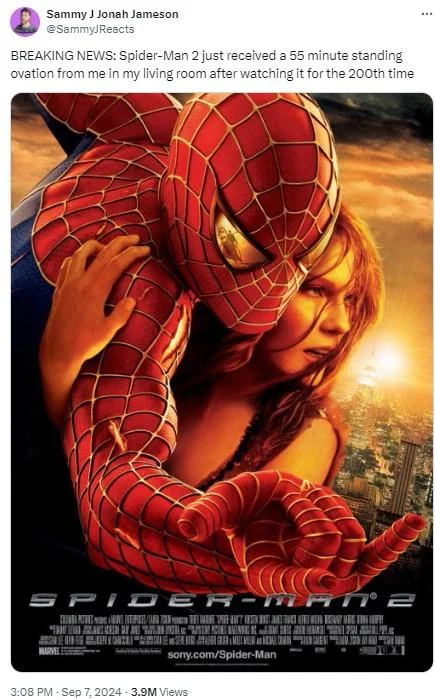 55 Minute Standing Ovation From Me In My Living Room — Twitter post celebrating Sam Raimi's Spider-Man 2 with standing ovation meme and poster.