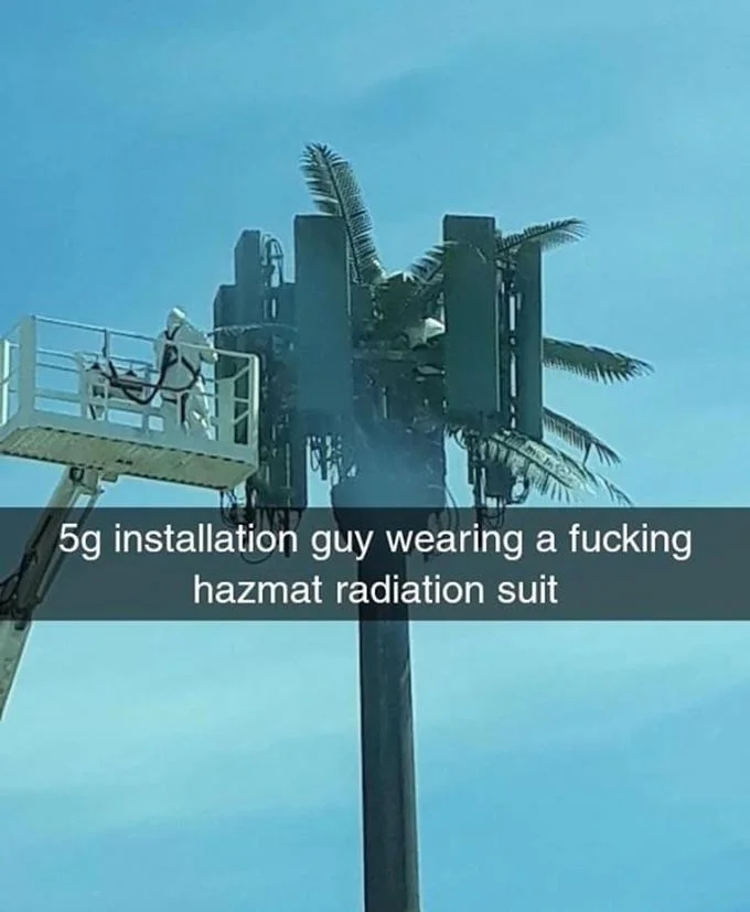 5G Its Fast Doe — A 5G tower installation worker wearing a hazmat radiation suit against a clear sky, reflecting conspiracy theories about 5G radiation