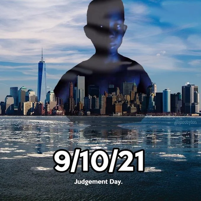 9 10 21 — A double-exposure image showing a dark silhouette with glowing eyes overlaid on the Manhattan skyline, captioned '9/10/21 Judgement Day'.