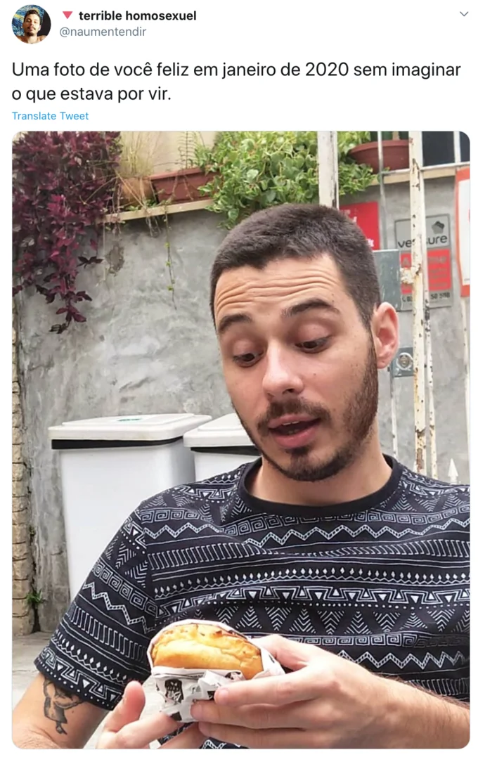 A Photo Of You In January 2020 Without Imagining What Would Come — Tweet screenshot of a young man eating a burger on the street