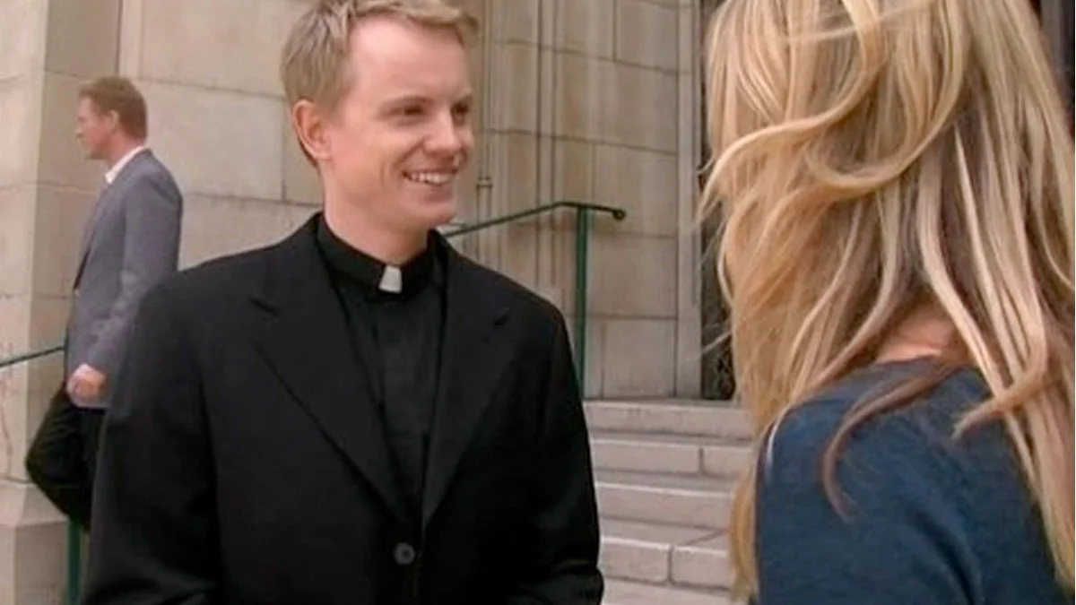 A Photo Of You In January 2020 Without Imagining What Would Come — Smiling young priest in clerical collar talking to a blonde woman outside a church