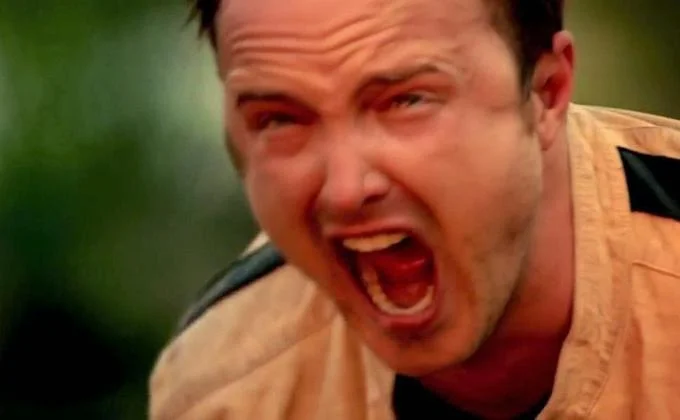 Aaron Paul Screaming — Aaron Paul as Jesse Pinkman screaming with mouth wide open in a tan jacket