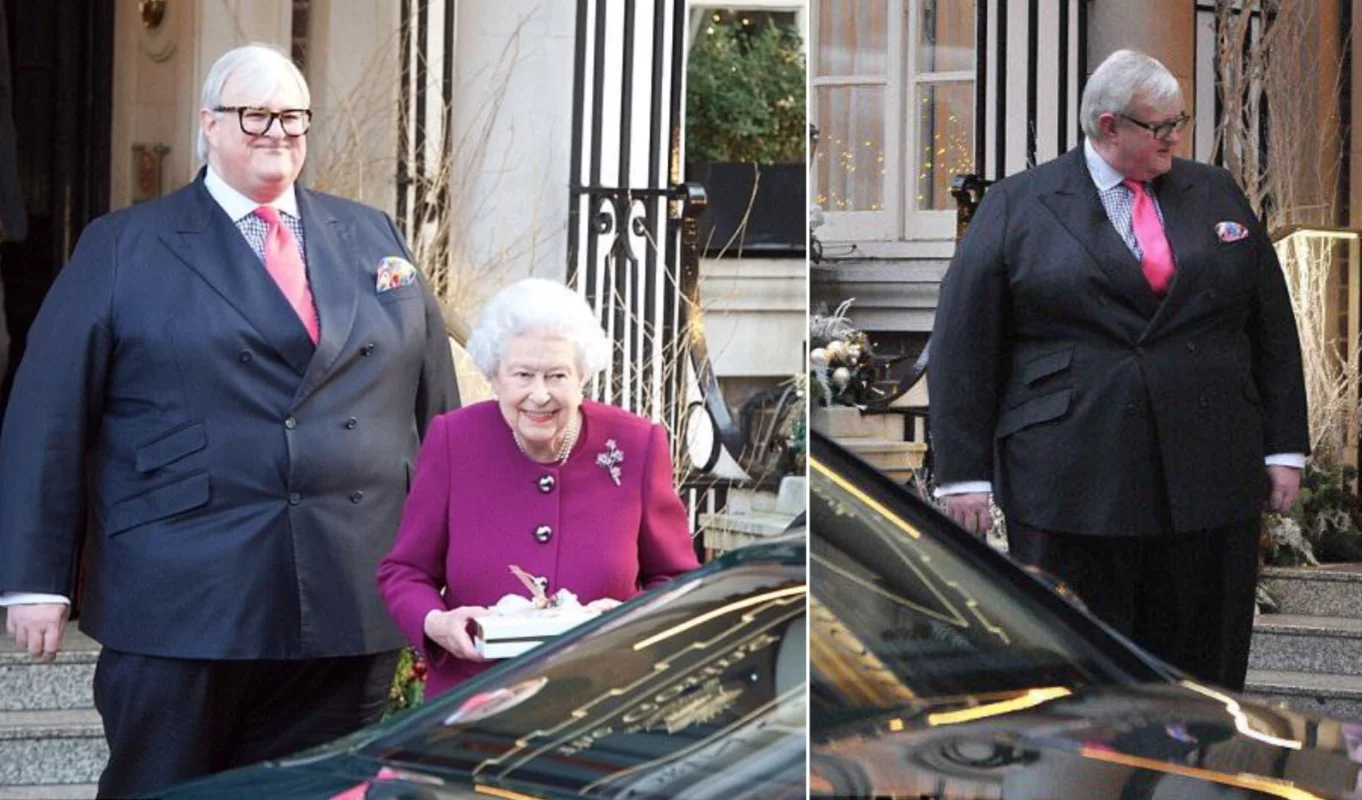 Absolute Unit — Large man in dark suit standing next to Queen Elizabeth II outside a building