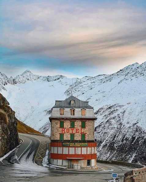 Accidental Wes Anderson — Red alpine hotel on a snowy mountain