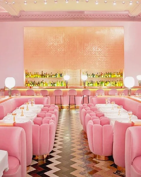 Accidental Wes Anderson — Pink velvet booths and checkered floor at Sketch London restaurant