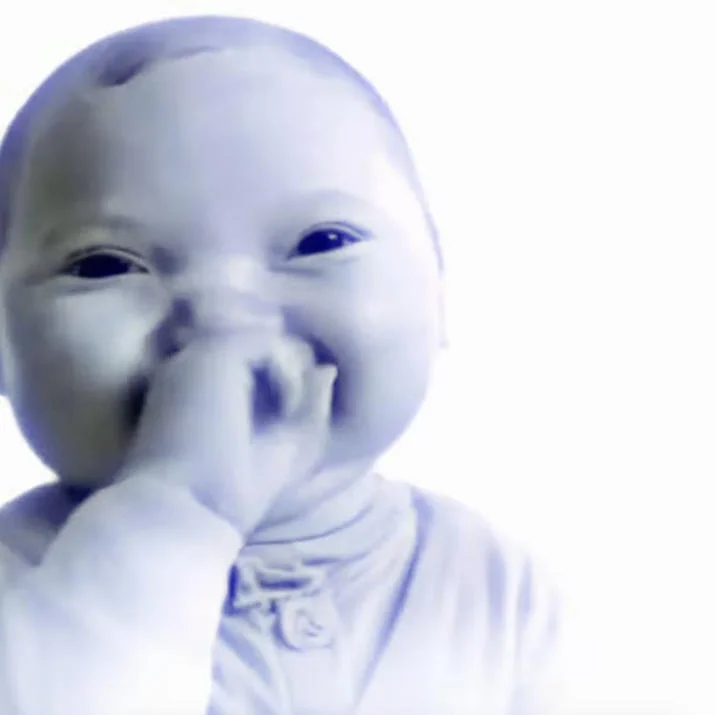 AI Baby Holding Laugh — Blue-tinted inverted AI baby covering mouth while laughing