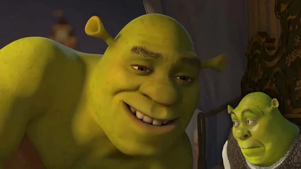 All Star / Shrek — CGI still from Shrek showing large grinning Shrek in foreground and smaller Shrek in background with warm interior lighting.