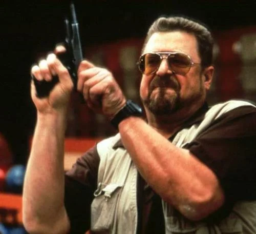Am I The Only One Around Here — Walter Sobchak holding a gun in a bowling alley from The Big Lebowski