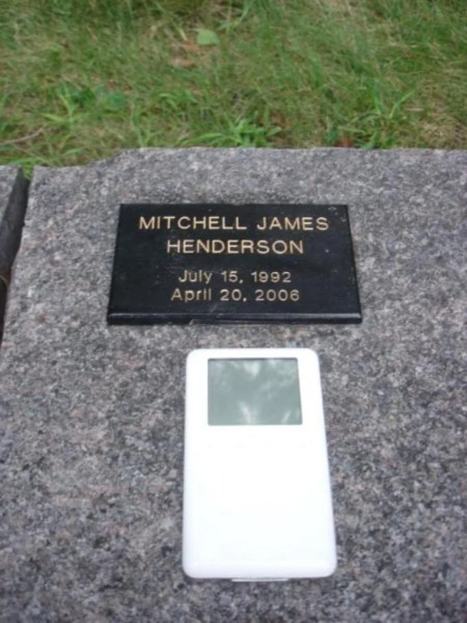 An Hero — Mitchell Henderson gravestone with iPod placed beside it