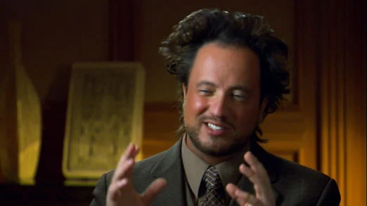 Ancient Aliens — Giorgio A. Tsoukalos with his signature hand-spread gesture in professional lighting from the television series.