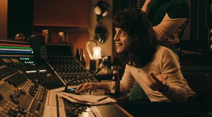 And This Is Where The Operatic Section Comes In — Freddie Mercury smiling at a studio mixing console in Bohemian Rhapsody