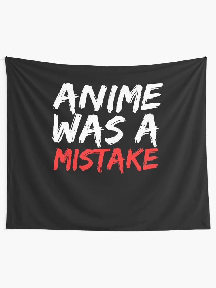 Black tapestry or banner merchandise featuring 'ANIME WAS A MISTAKE' with red emphasized lettering.