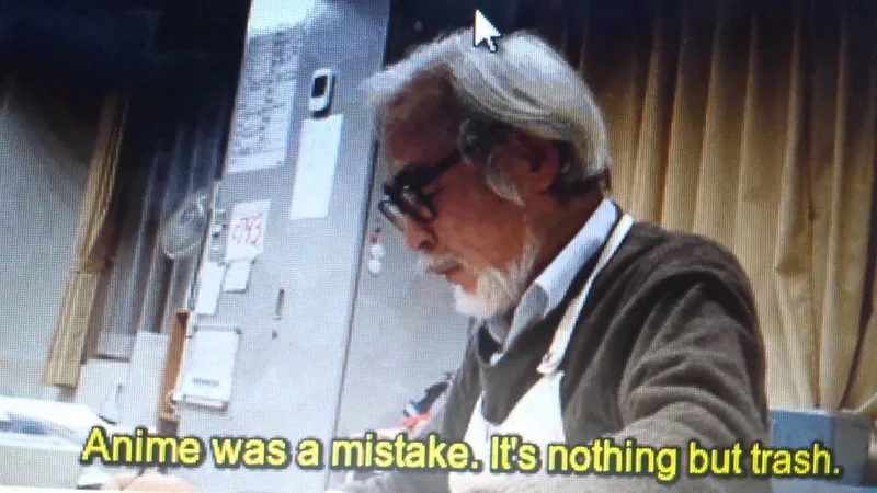 Anime Was a Mistake — Professional quality black and white portrait of Hayao Miyazaki wearing glasses in serious contemplation with quote.