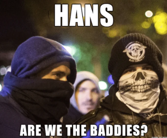 Masked protesters with skull bandana captioned Hans are we the baddies