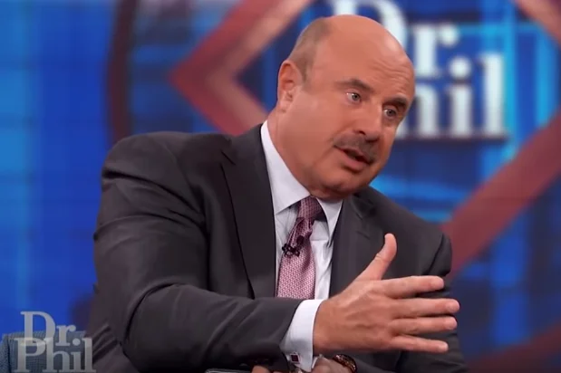 Are You Delusional Do You Suffer From A Mental Illness — Dr. Phil McGraw gesturing on his talk show set with a skeptical expression
