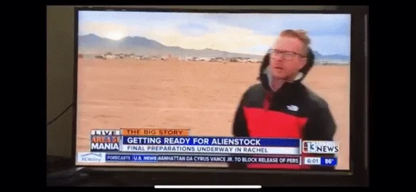 Area 51 Naruto Run — Television screen showing Area 51 live news broadcast from viral event