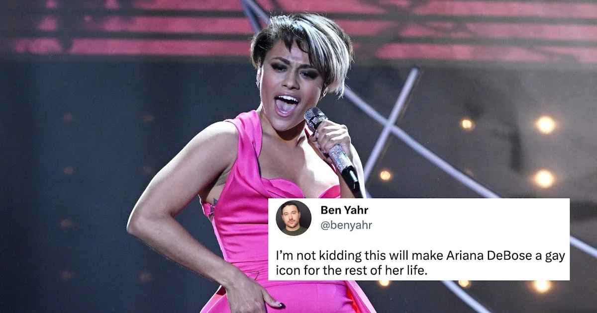 Ariana DeBose BAFTA Rap — Ariana DeBose performs on stage in vibrant pink dress holding microphone during viral BAFTA performance.