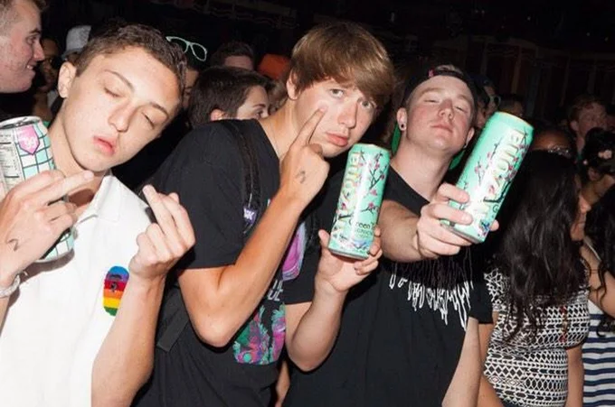 Arizona Iced Tea — Group of teens posing with Arizona Green Tea cans at a party
