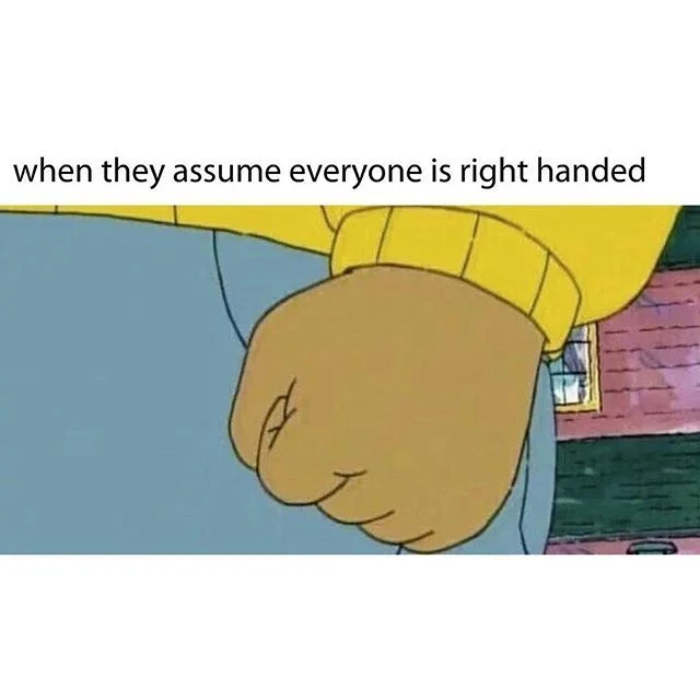Arthur's Fist meme showing clenched fist in yellow sweater with text 'when they assume everyone is right handed'.