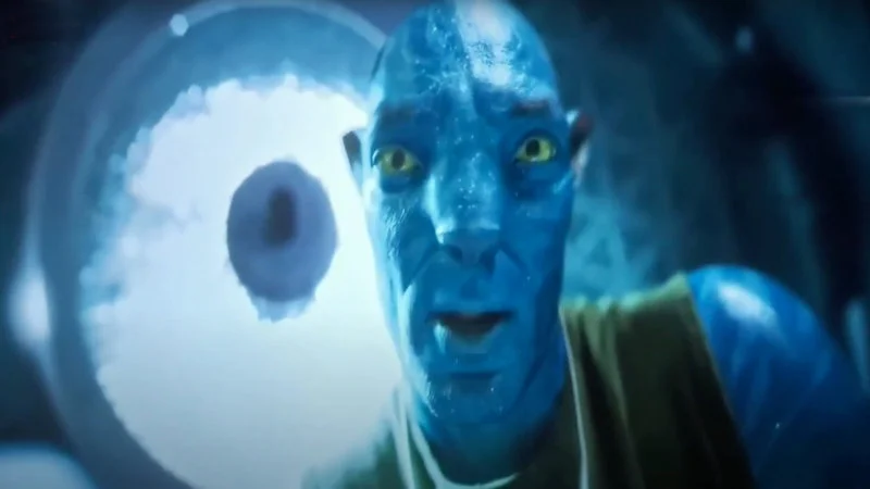 Avatar Chud — Close-up of a blue Na'vi character with wide, startled yellow eyes