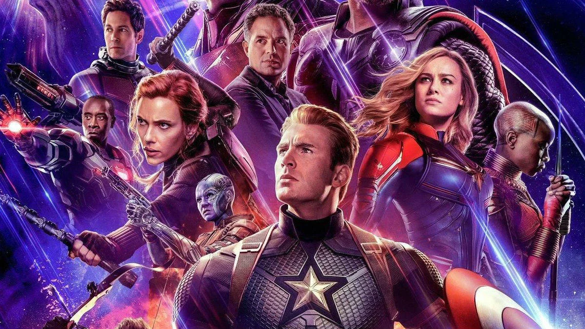 Avengers Endgame — Avengers: Endgame movie poster with ensemble Marvel superhero cast on purple cosmic background