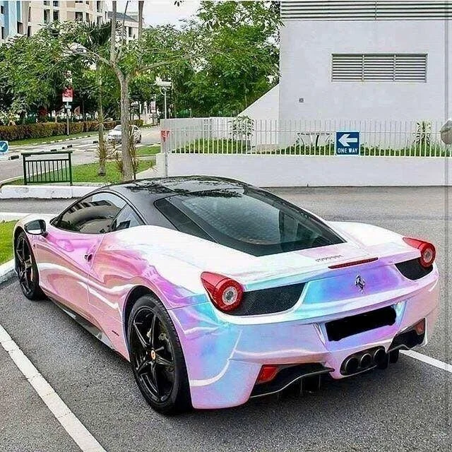 Awful Taste, But Great Execution — Ferrari sports car with holographic iridescent pink chrome wrap