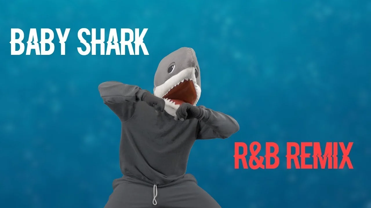 Video thumbnail of person in shark costume with 'BABY SHARK R&B REMIX' text.