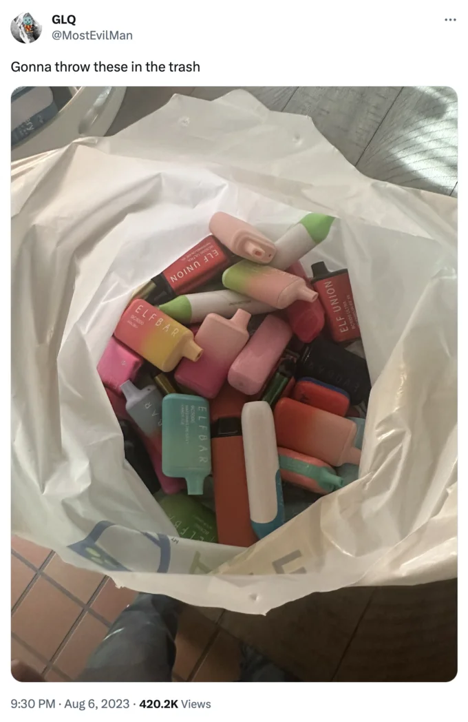 Bag Full of Elf Bars — Tweet by @MostEvilMan reading 'Gonna throw these in the trash' above the bag of Elf Bar vapes