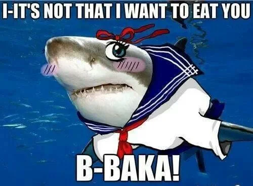 Cute shark character in red bow saying 'B-Baka!' in water, tsundere animal meme format