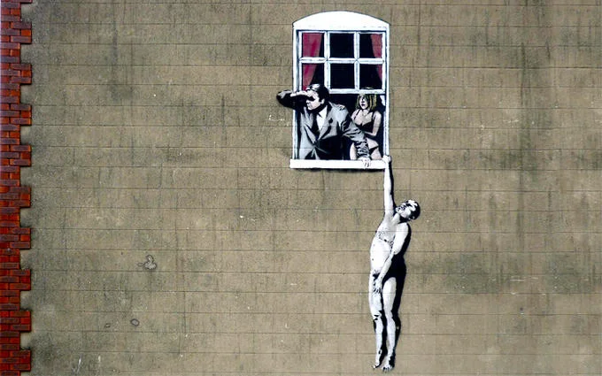 Banksy mural of naked man hanging from window as husband looks out