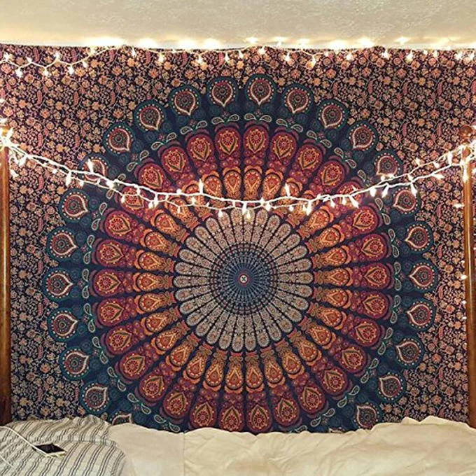 Basic White Girl Tapestry Mid Girl Pride Flag — Clean photo of blue and red mandala tapestry with string lights on bedroom wall.