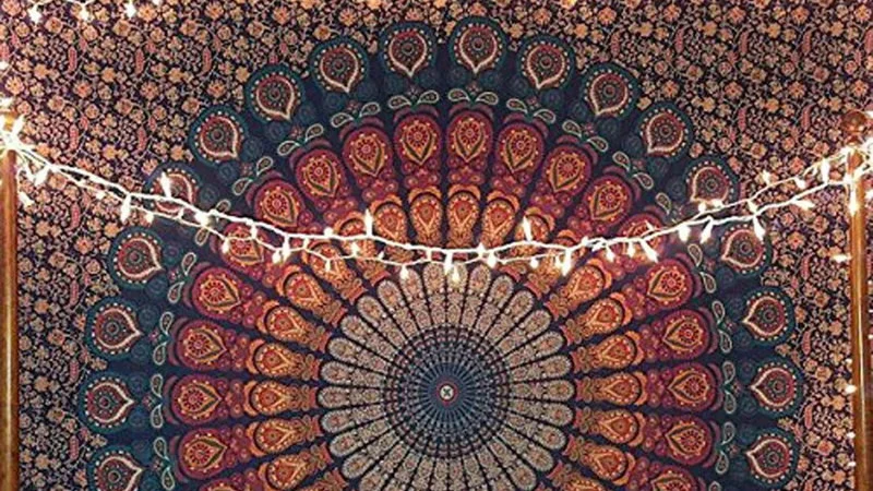 Basic White Girl Tapestry Mid Girl Pride Flag — Close-cropped photo of blue and red mandala tapestry with fairy string lights.