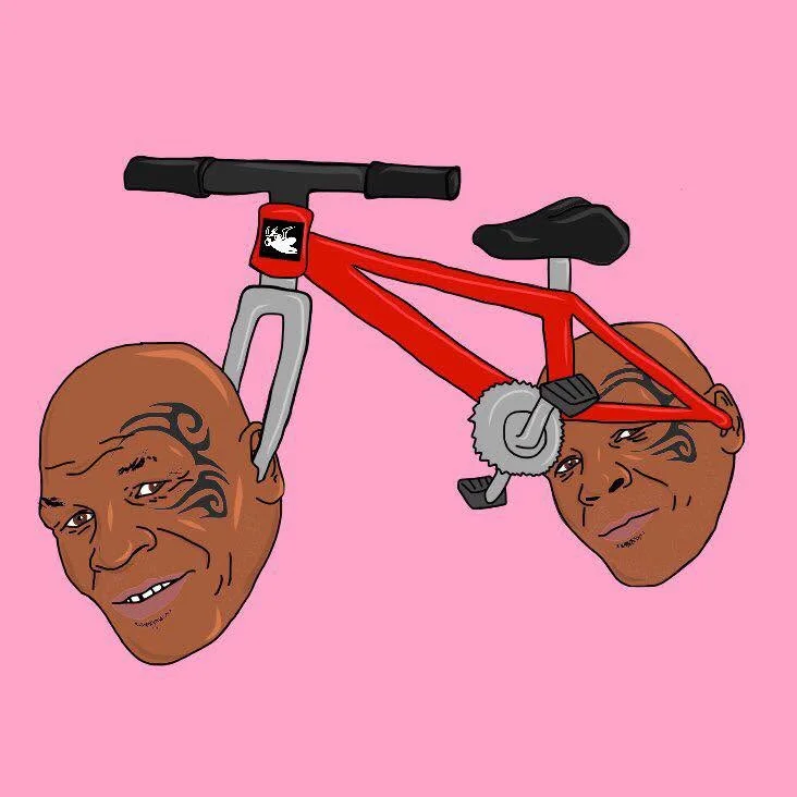 Bike Tyson — Cartoon illustration of a red BMX-style bike with two Mike Tyson heads at the handlebars and pedals on a pink background.