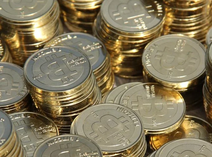 Stacks of physical Casascius Bitcoin coins packed together