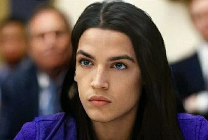 Blonde AOC — AOC digitally altered to appear as a long-haired man with blue eyes wearing a purple blazer.