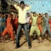 Bollywood Movie Dance Remixes — A vibrant Bollywood film dance scene with a central male dancer in dark clothing in an energetic pose, flanked by backup