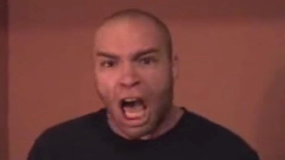 Bald man screaming with mouth wide open, FPSCarl from the Boom Headshot video