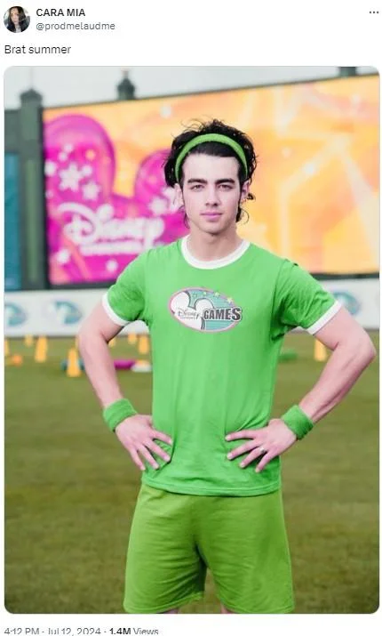 Brat Summer — A person wearing a bright lime green shirt and accessories posing against vibrant pink and lime green graffiti art.