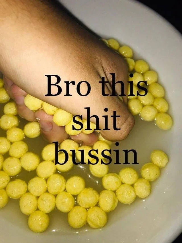 Hand holding yellow food/snacks with text bro this shit bussin