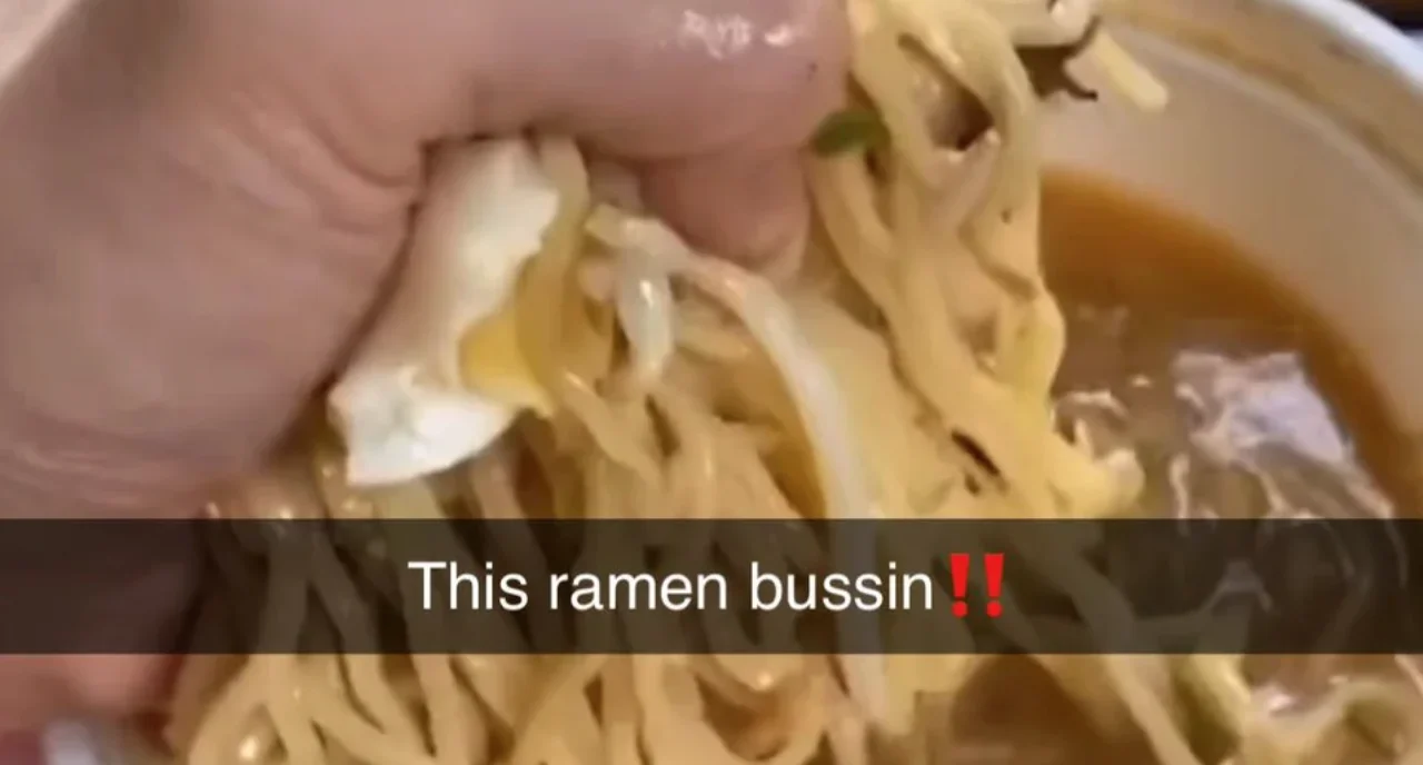 Ramen noodles with chopsticks and text This ramen bussin with fire emojis