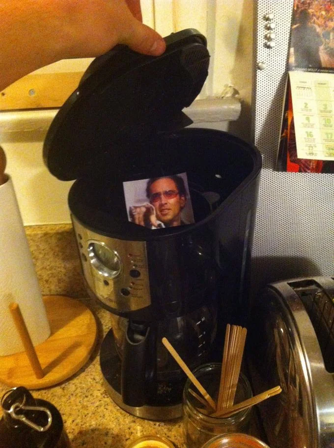 Caging — Nicolas Cage photo hidden inside a coffee maker's filter basket